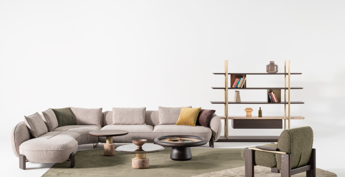 Stylish room showcasing neutral corner sofa and textured green rug.