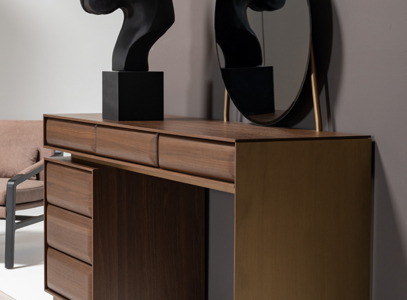 Luxury bedroom with leather‑panel bed, sculptural accessories, and minimalist contemporary styling.