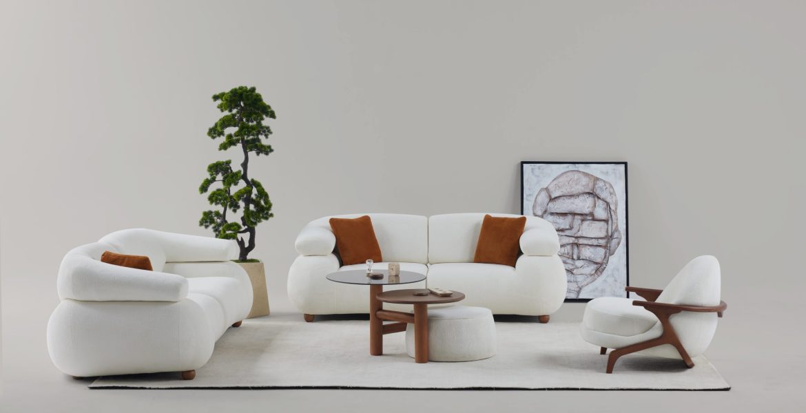 Bright living room with textured seating and rounded dining chairs.