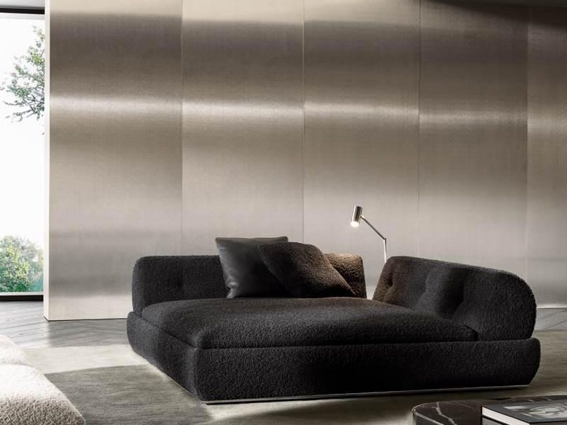 Modern space with minimalist sofa set and warm wooden shelving.