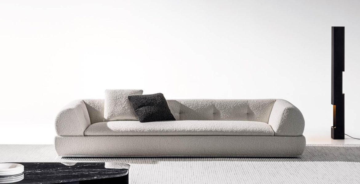 Stylish living area with sectional sofa and geometric artwork.
