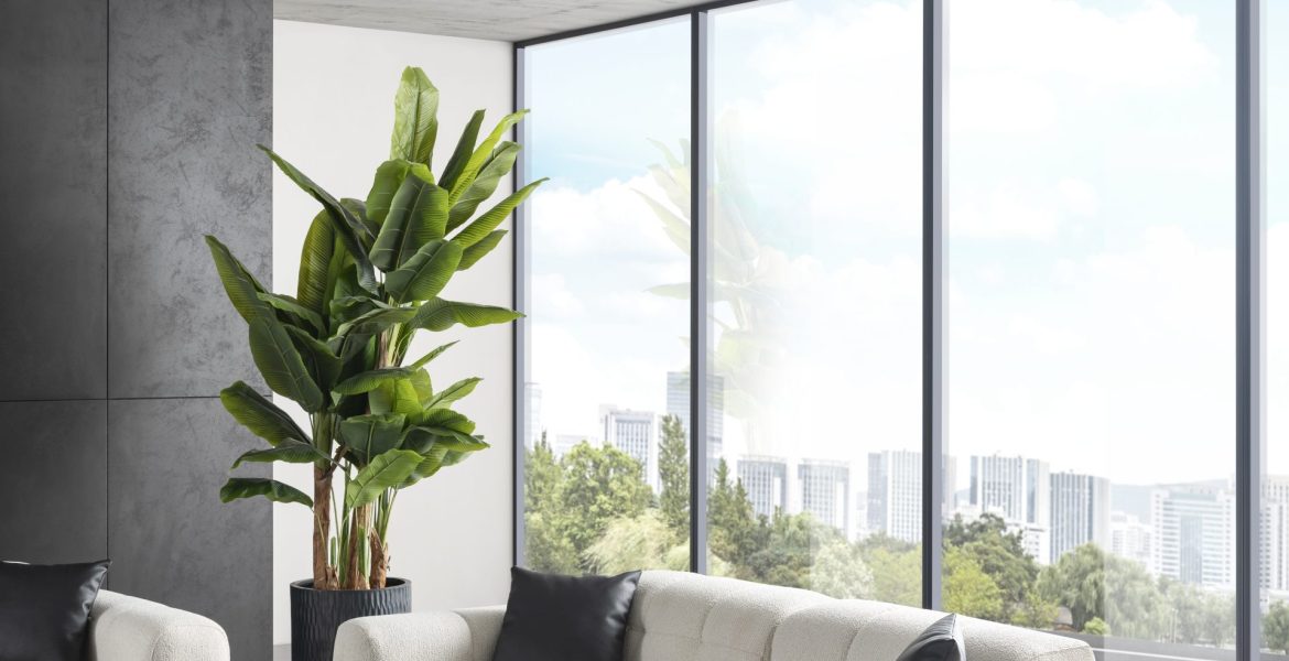 Minimalist interior with sofa set, console table, and large windows.