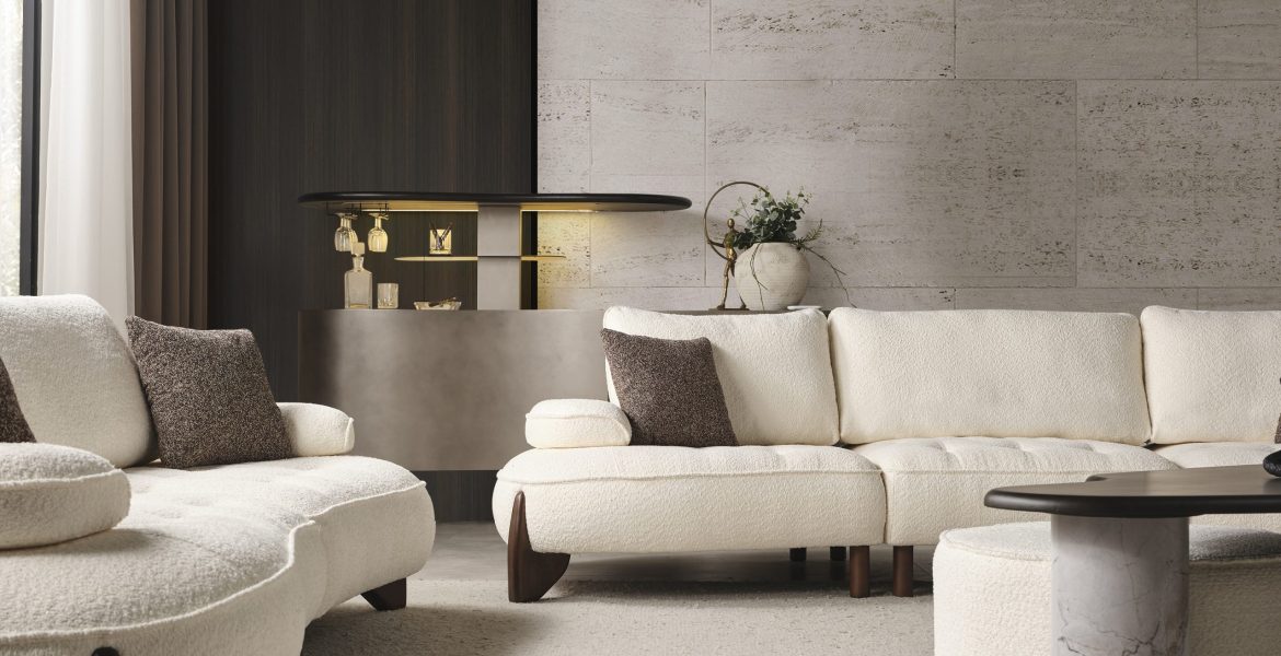 Minimalist interior with sofa set, ottoman, and console table décor.