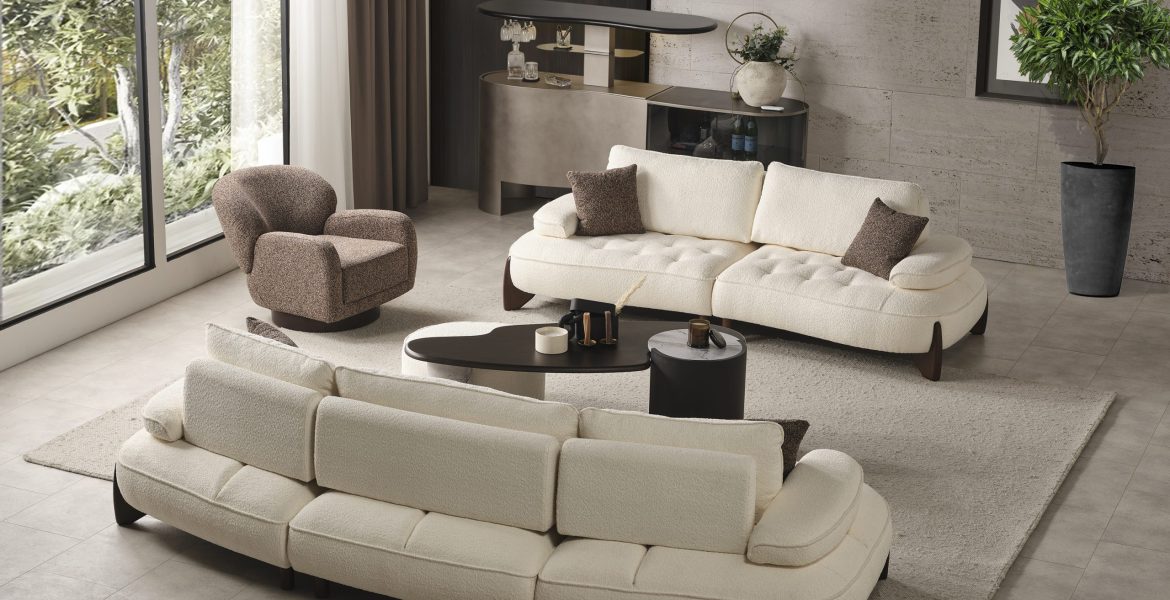 Elegant room with sectional sofa, chaise lounge, and abstract wall art.