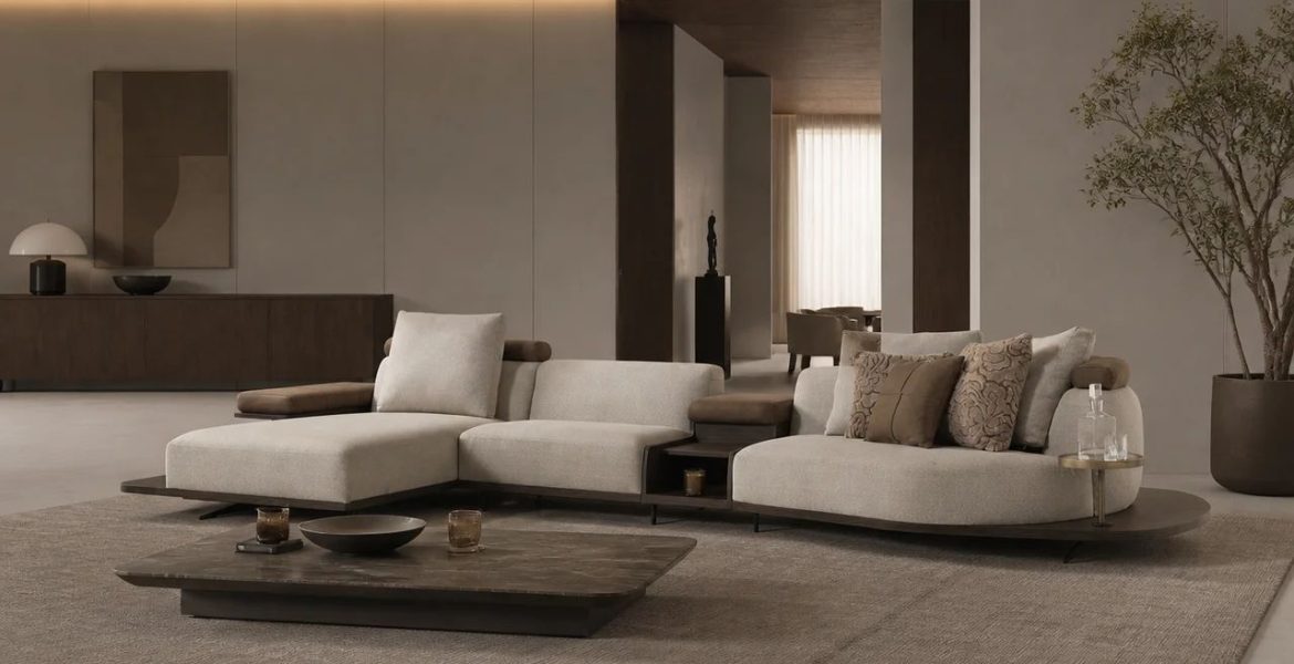 Modern living room with beige corner sofa and metal‑frame armchair.