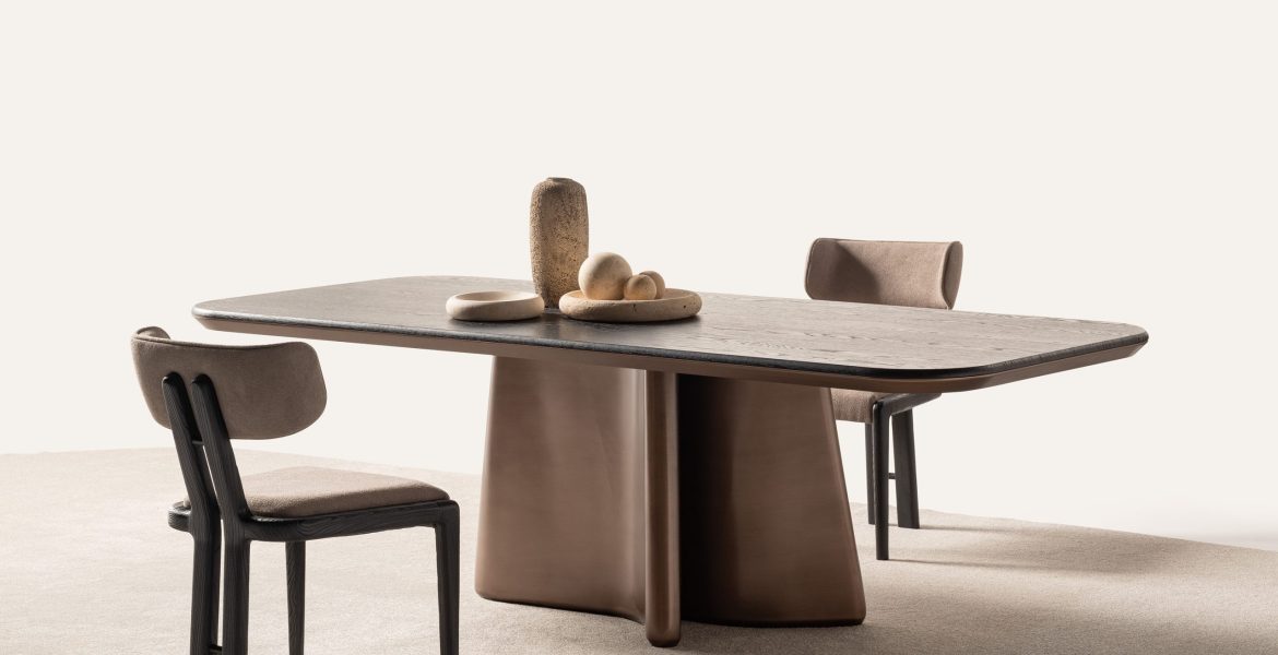 Noa Dining Room Furniture including sculptural table and upholstered chairs.