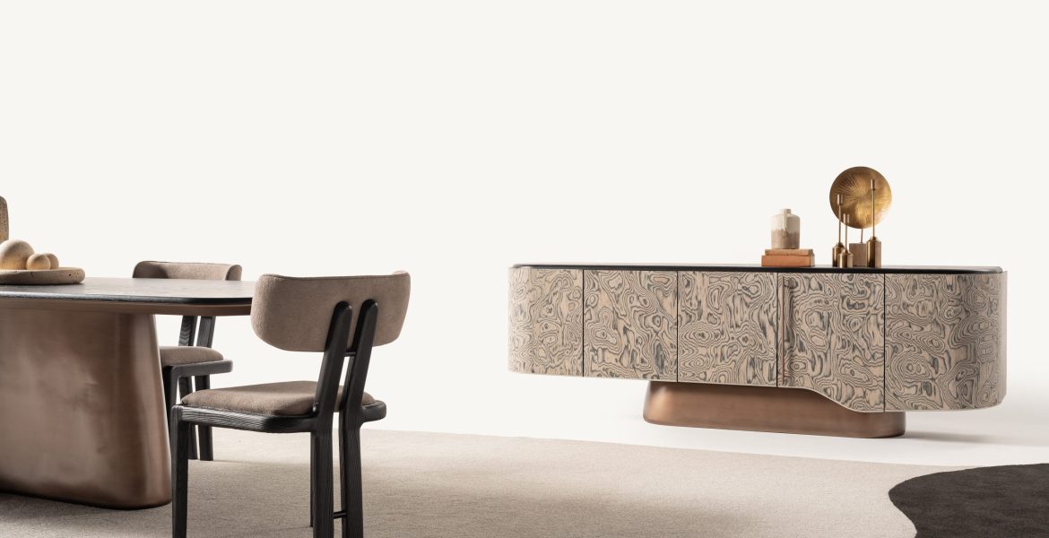 Contemporary wooden dining table paired with two minimalist chairs.