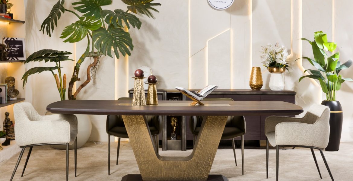 Modern dining room with wooden table and upholstered chairs.
