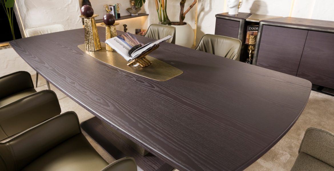 Modern space with dark wooden table and beige dining chairs.