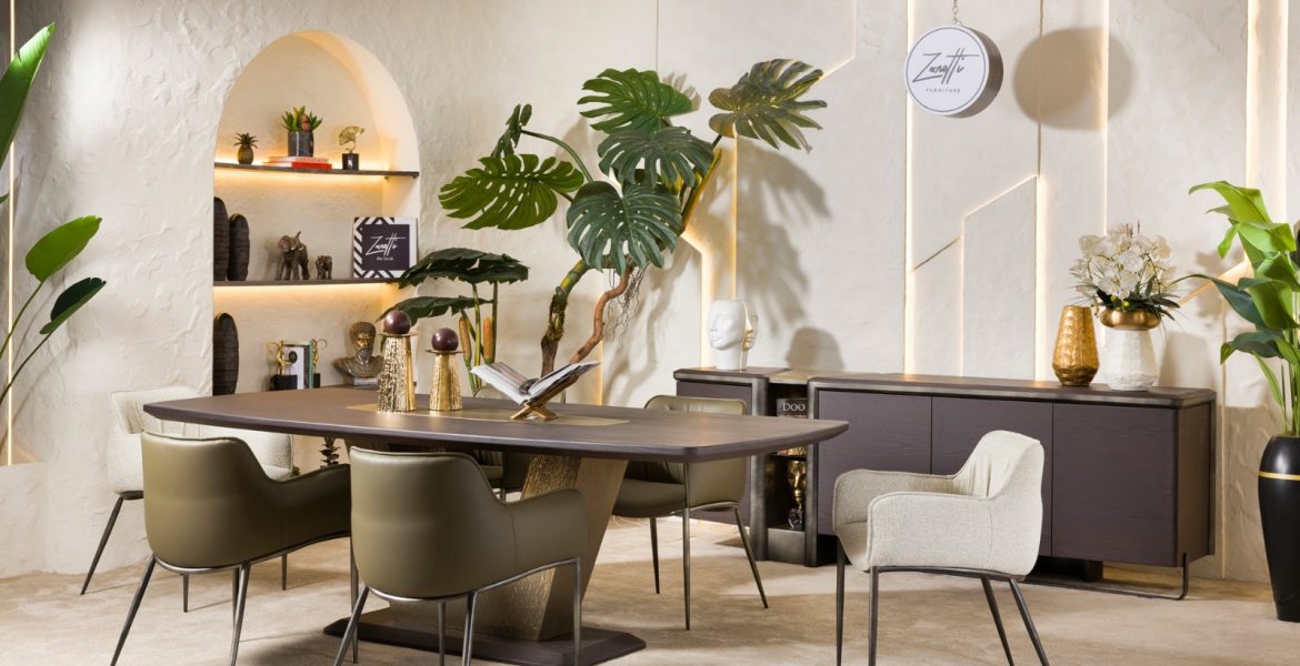 Minimalist dining room with olive leather chairs and wooden table.