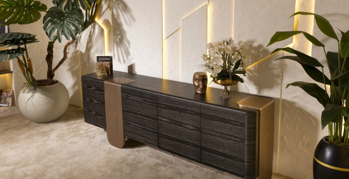 Dark wooden sideboard with bronze accent.