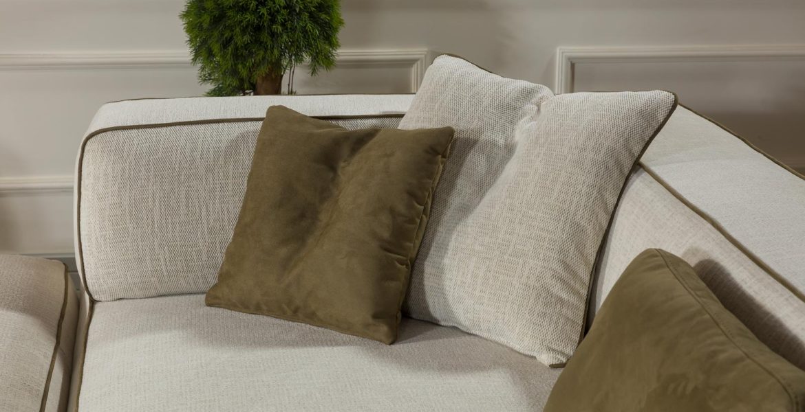 Soft upholstered Living Room sofa with structured edges.