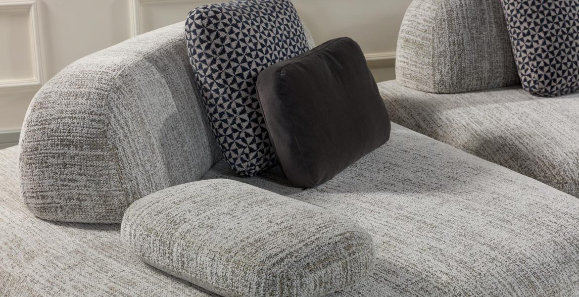 Gray upholstered sofa with plush seating.