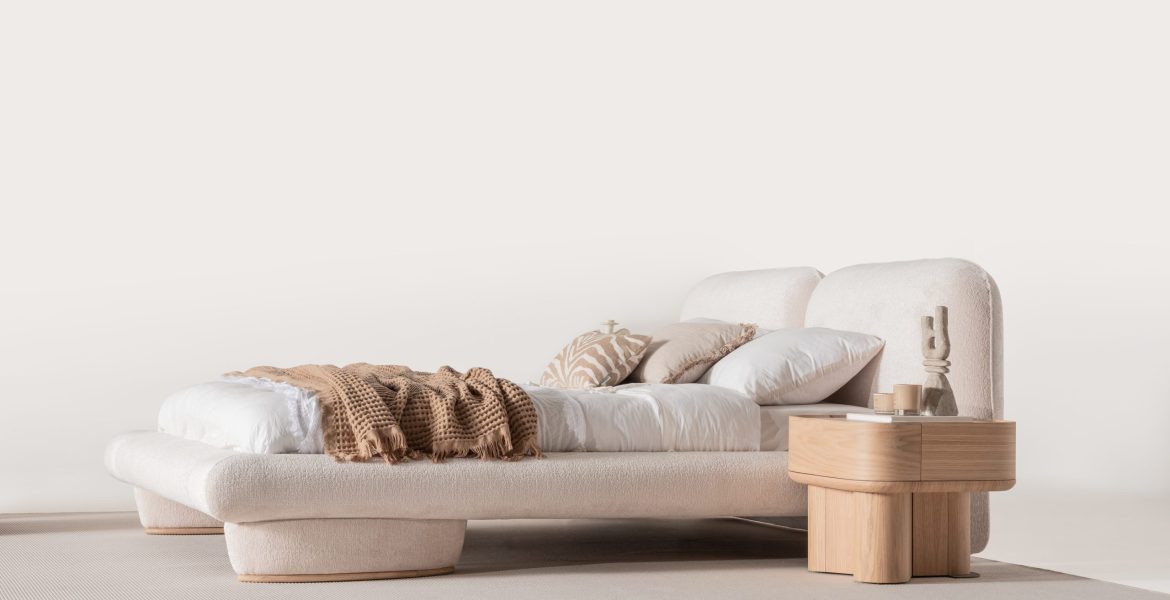 Bed paired with wooden nightstands.