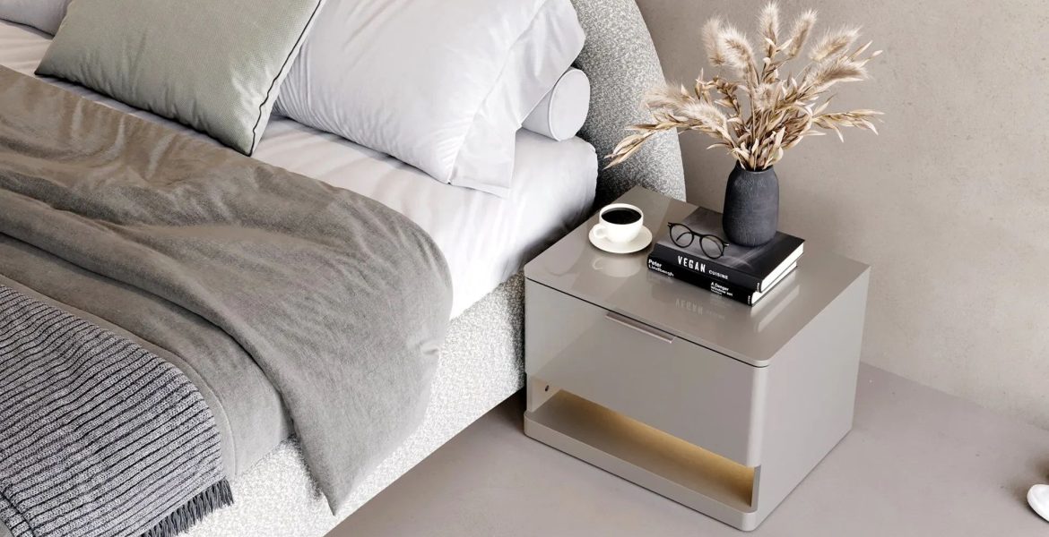 Soft upholstered bed with curved edges.