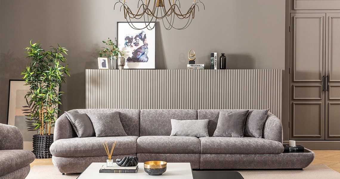 Soft gray sofa with textured cushions.