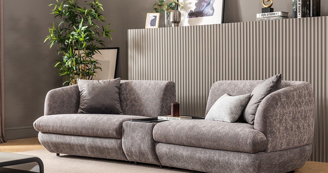 Gray upholstered sofa with plush seating.