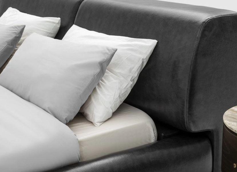 Wooden nightstands with curved edges.