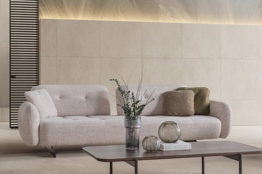 Beige upholstered sofa with soft fabric.