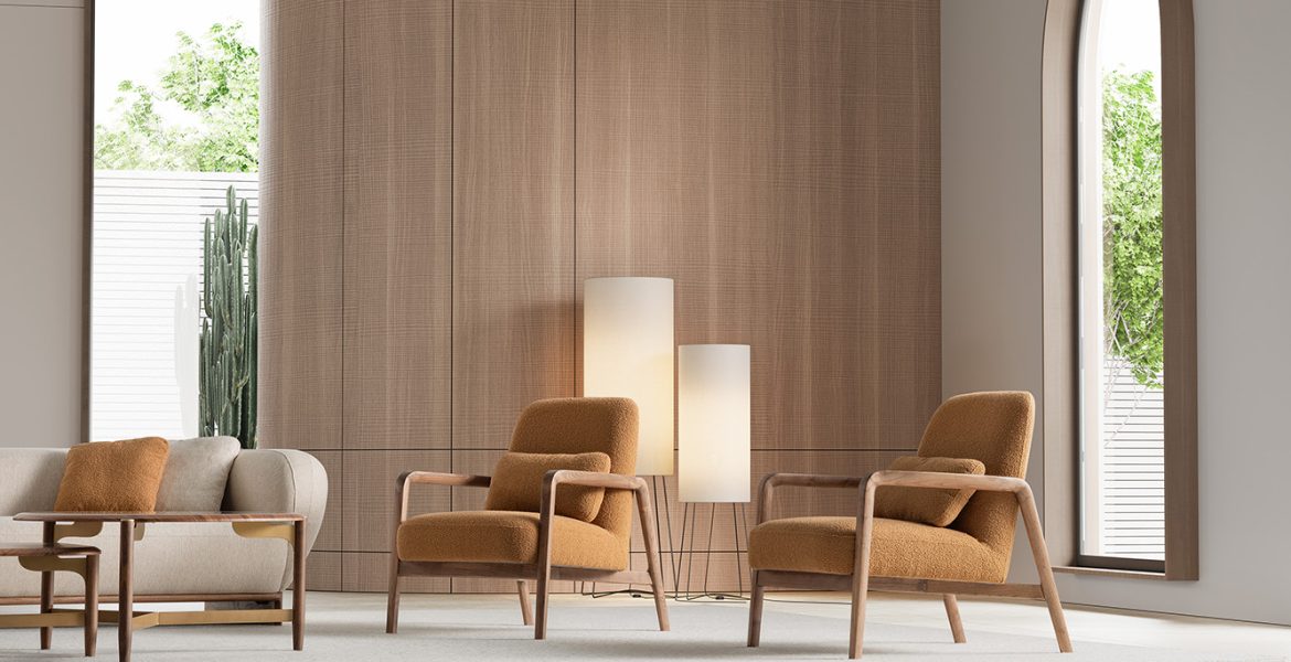 Wooden armchairs with warm fabric upholstery.