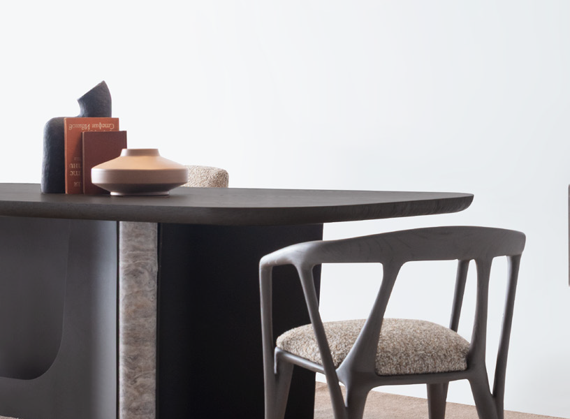 Minimalist dining chairs with curved frames.