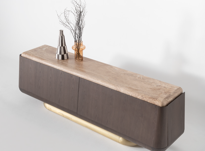 Modern dining table with rounded wooden top.
