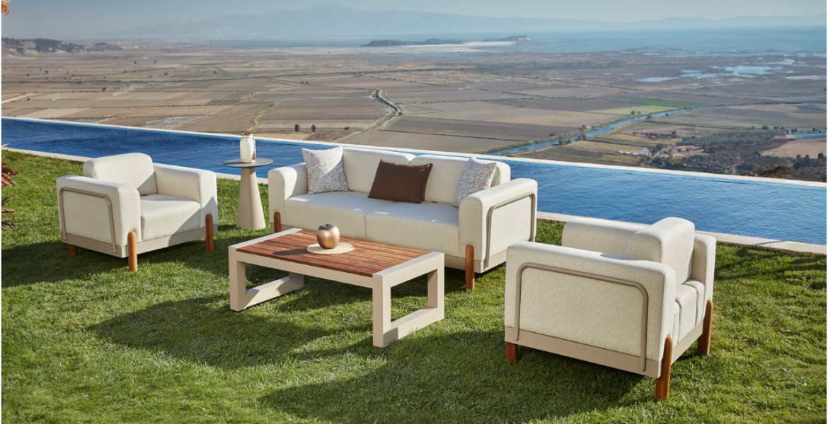 Outdoor sofa set beside infinity pool with scenic landscape