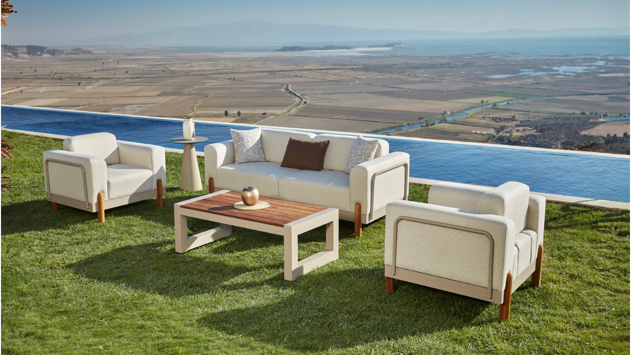 Outdoor sofa set beside infinity pool with scenic landscape