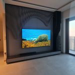 Contemporary TV wall panel with storage cabinets and display shelves